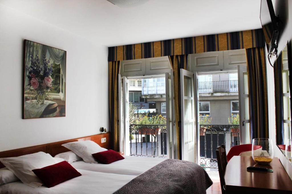 Posteľ alebo postele v izbe v ubytovaní Hotel Hórreo by Bossh! Hotels