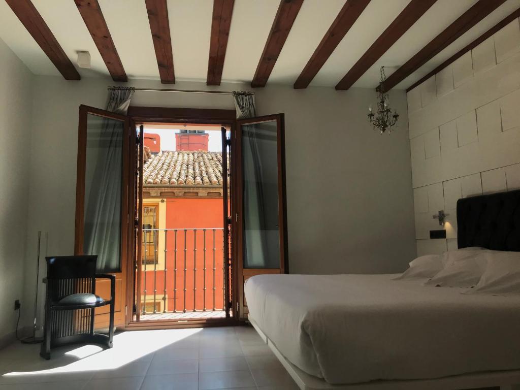 Posada del León de Oro Boutique Hotelにあるベッド