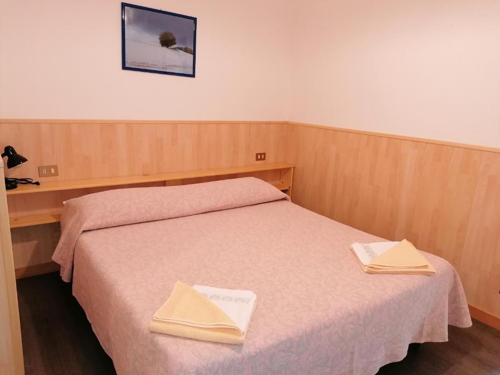 Łóżko lub łóżka w pokoju w obiekcie Al Fogolar