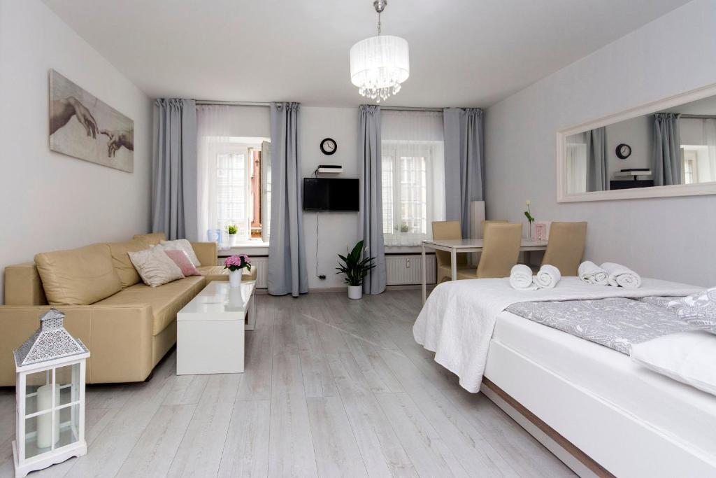 Posteľ alebo postele v izbe v ubytovaní Twój Salon-Apartamenty Stare Miasto