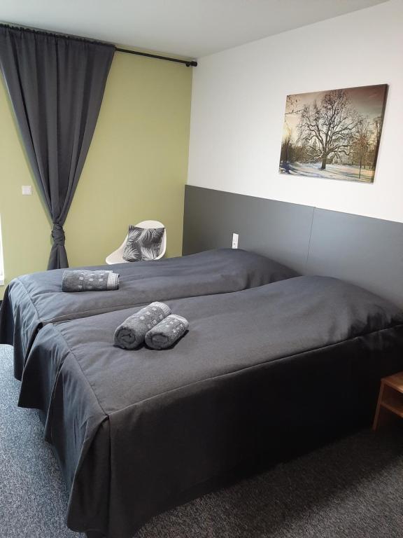 Postel nebo postele na pokoji v ubytování Office Base Bad Vöslau MOTEL