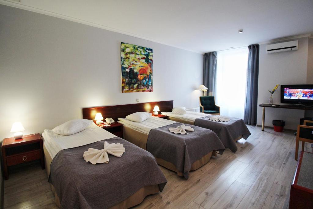 Postel nebo postele na pokoji v ubytování A1 Hotel Riga City Center