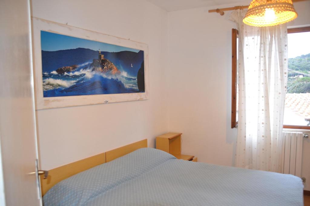 Postel nebo postele na pokoji v ubytování Hotel Scoglio Bianco