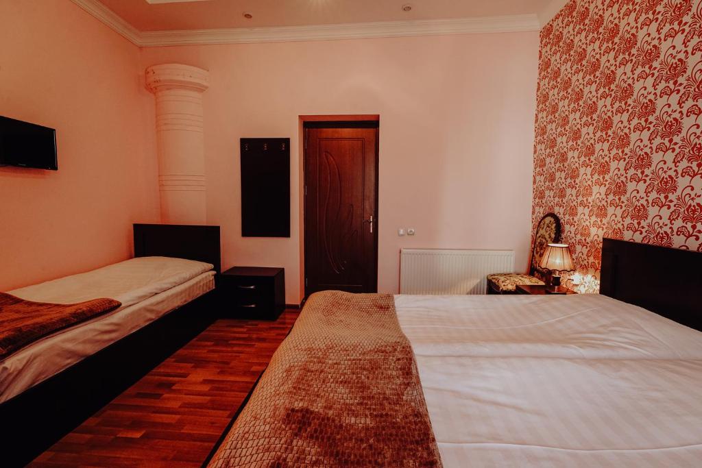 Postel nebo postele na pokoji v ubytování Hotel Eurica