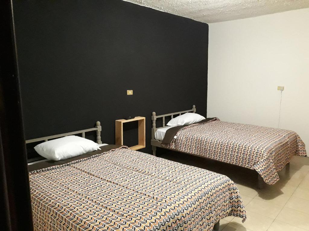 Postel nebo postele na pokoji v ubytování Posada Loreto Xalapa