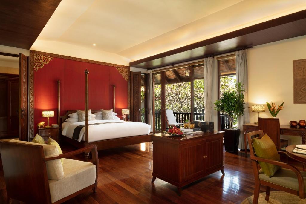 Postel nebo postele na pokoji v ubytování Anantara Angkor Resort