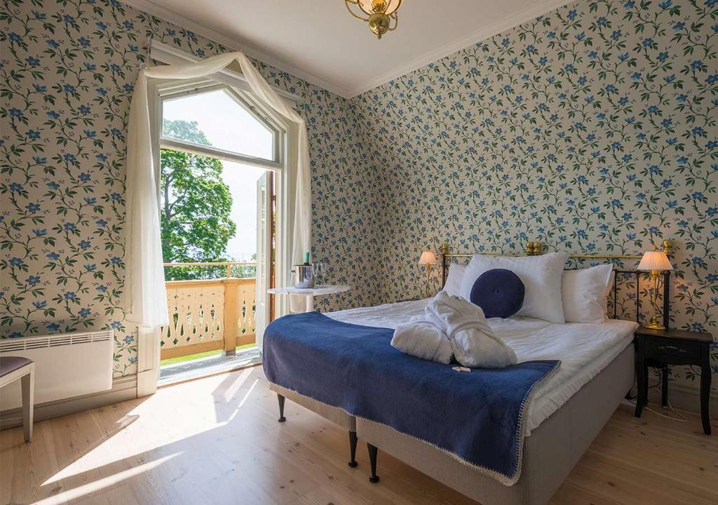 Postel nebo postele na pokoji v ubytování Hotel Bellevue