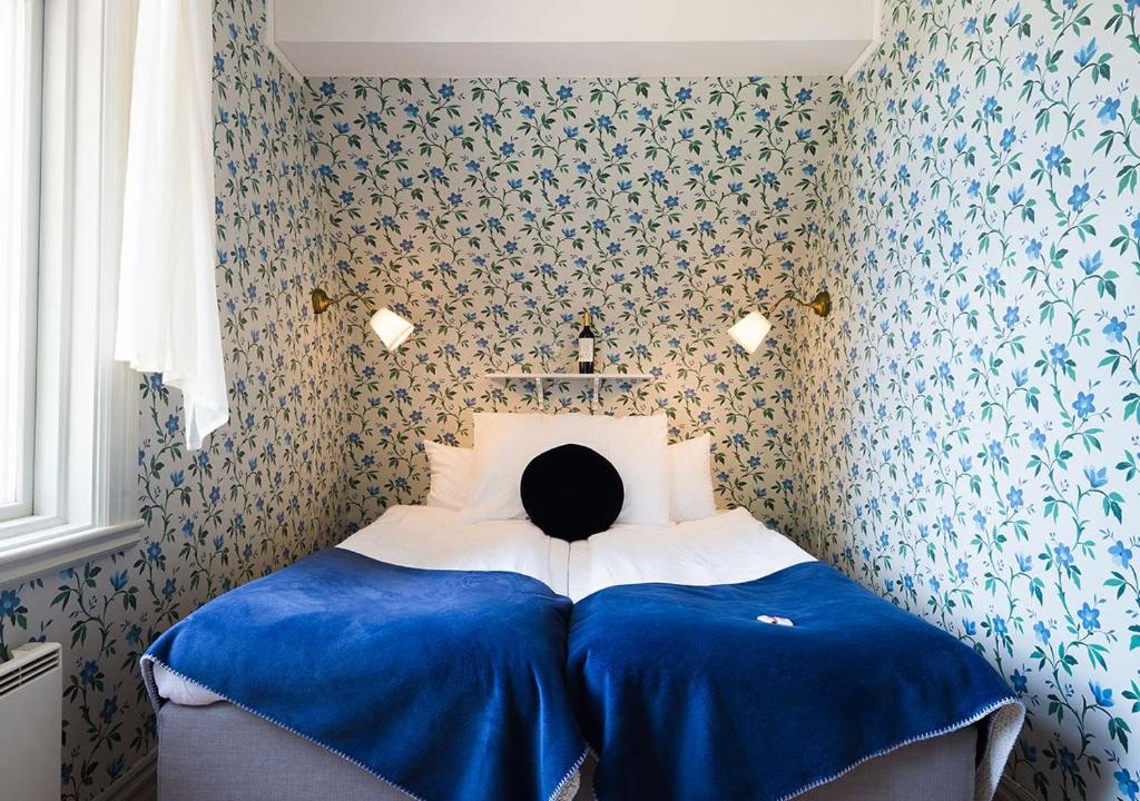 Postel nebo postele na pokoji v ubytování Hotel Bellevue
