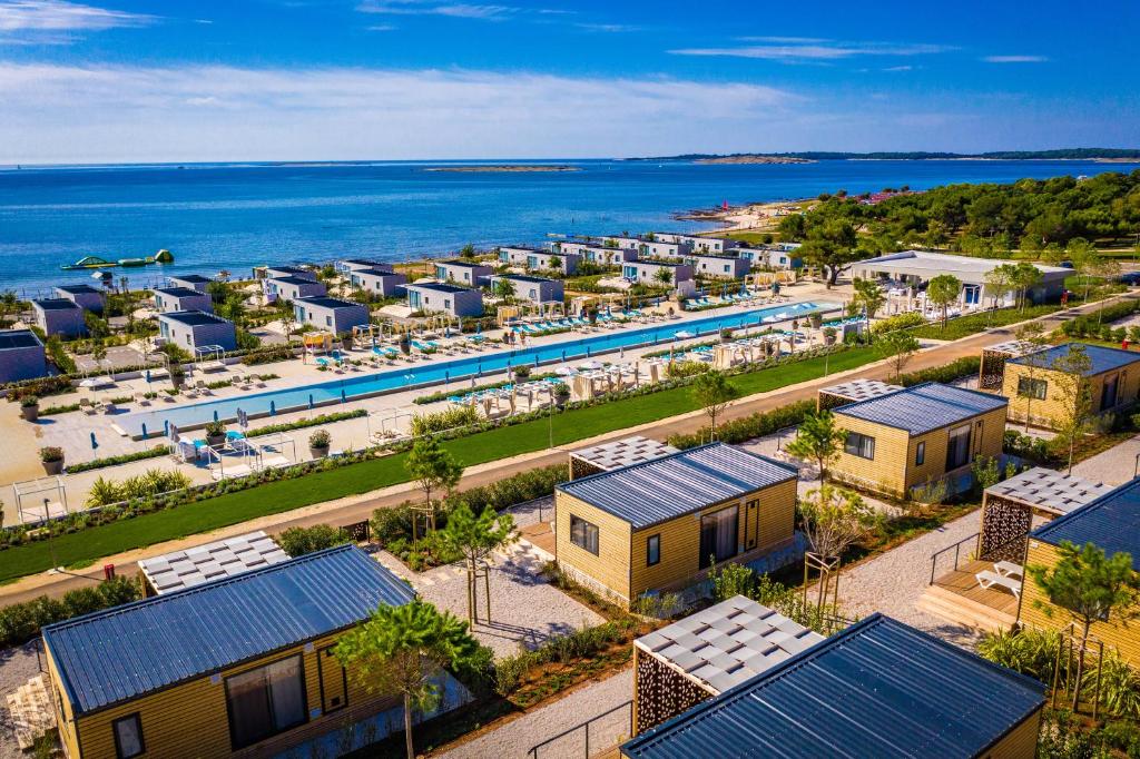 an aerial view of a resort next to the ocean at Arena Grand Kazela Camping Homes in Medulin