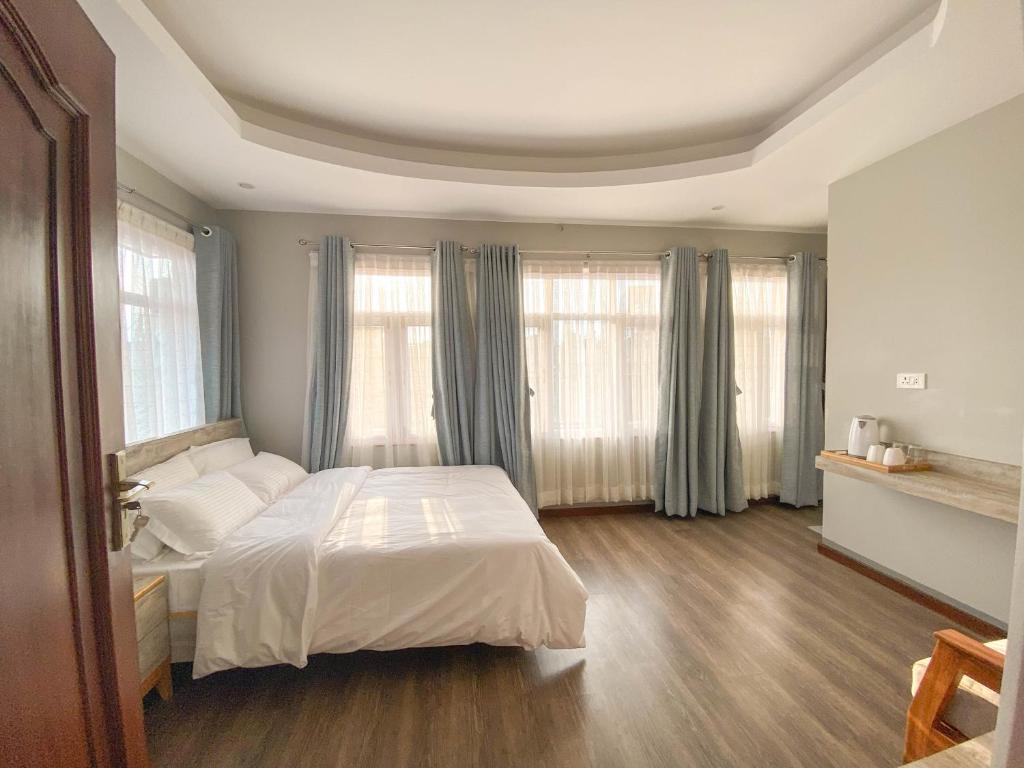 Postel nebo postele na pokoji v ubytování Kibu Home