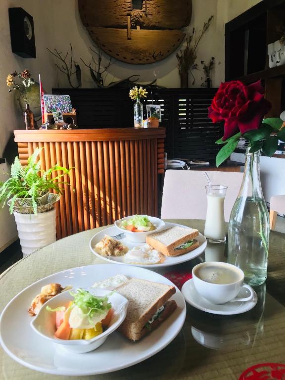 a table with three plates of food on it at Bridge12th B&amp;B in Yanliau