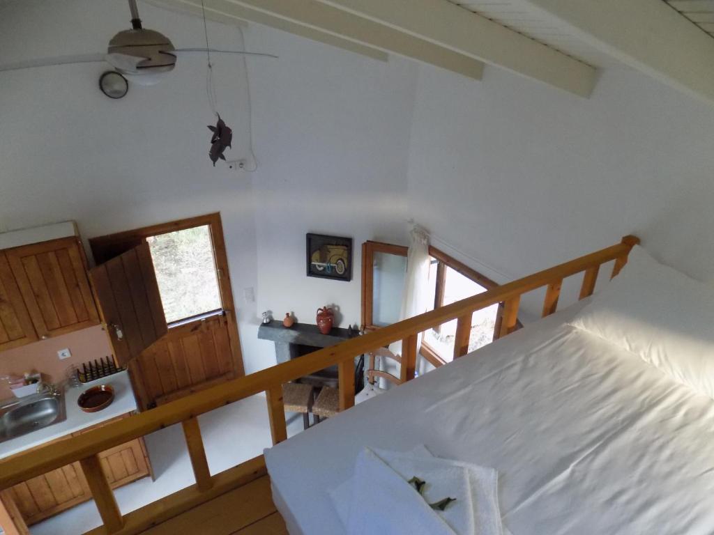 Postel nebo postele na pokoji v ubytování Cottage1Το μικρό σπίτι στο λιβαδι