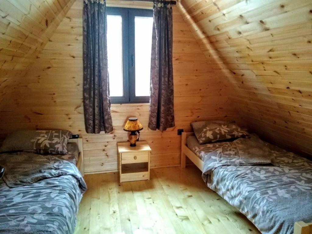 Postel nebo postele na pokoji v ubytování Lodge Sisters