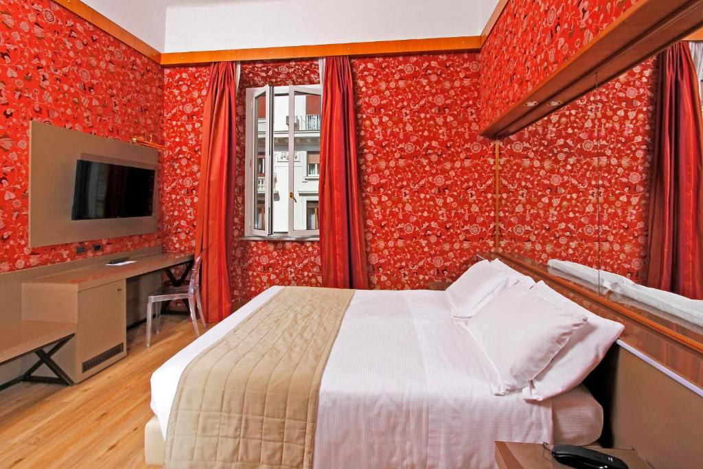 TV a/nebo společenská místnost v ubytování Hotel Arcangelo