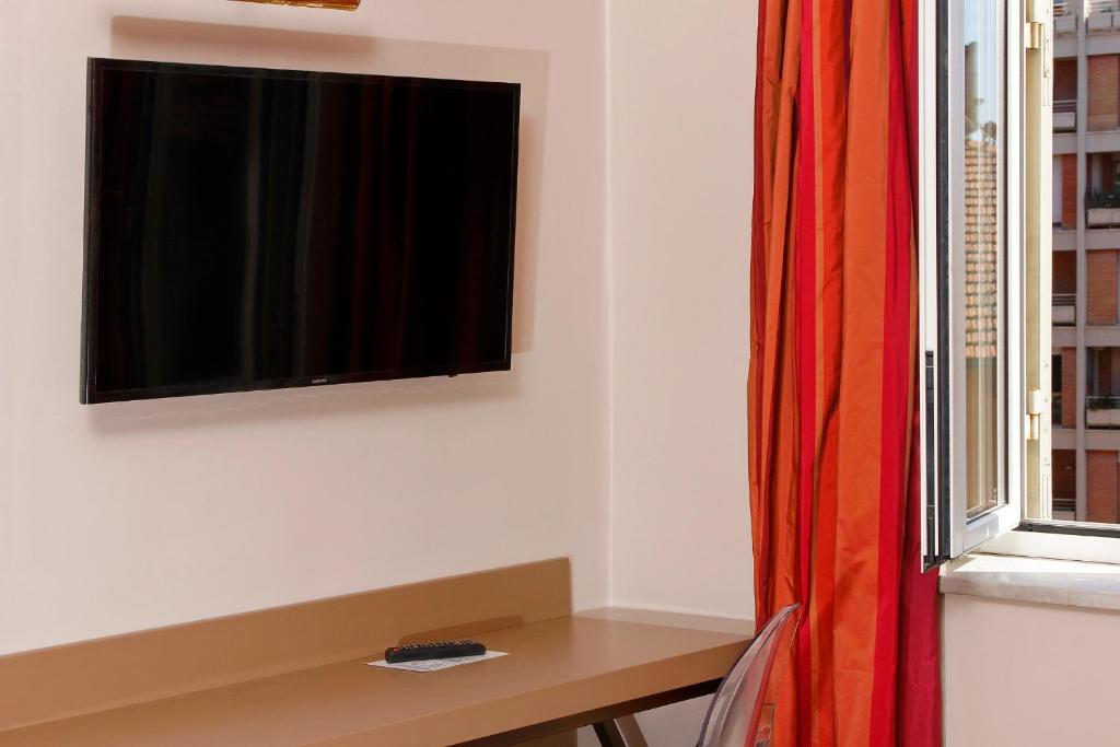TV a/nebo společenská místnost v ubytování Hotel Arcangelo