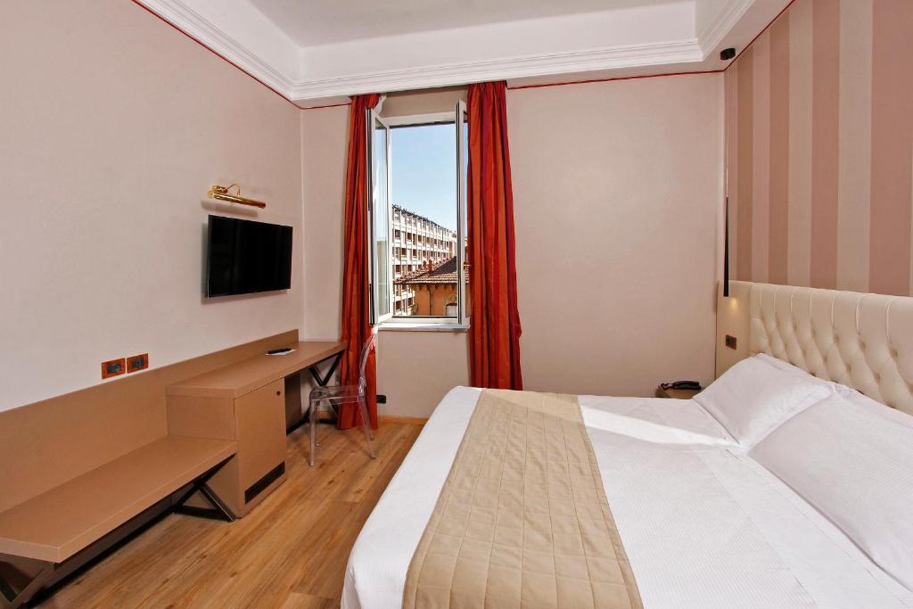 TV a/nebo společenská místnost v ubytování Hotel Arcangelo