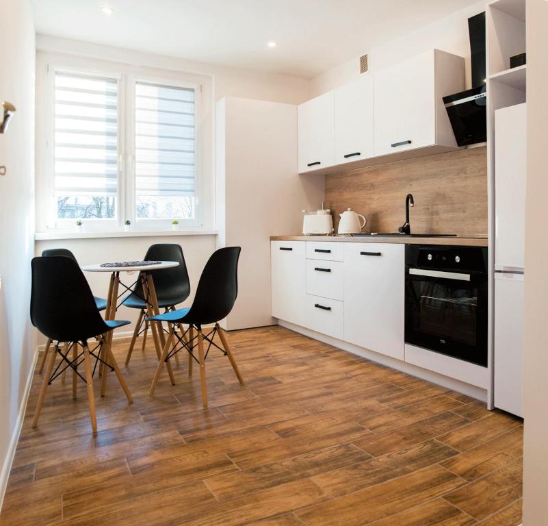 Kuchyň nebo kuchyňský kout v ubytování Apartament Gosia