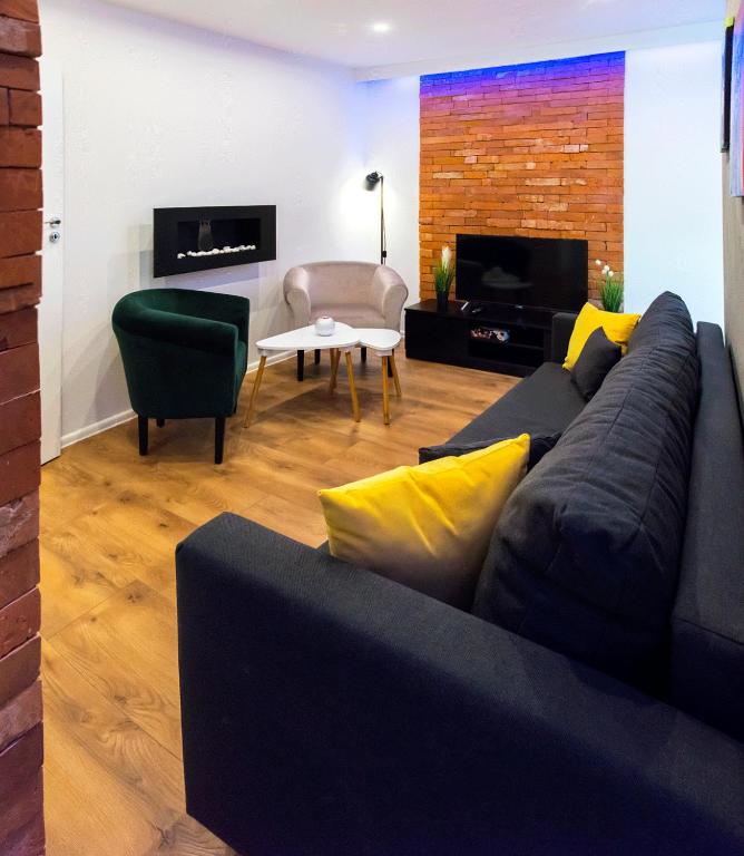 TV a/nebo společenská místnost v ubytování Apartament Gosia