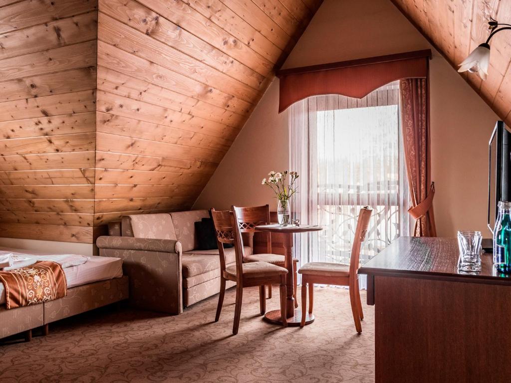 Posezení v ubytování Villa Magnat SPA, JACUZZI, SAUNA, TĘŻNIA SOLANKOWA