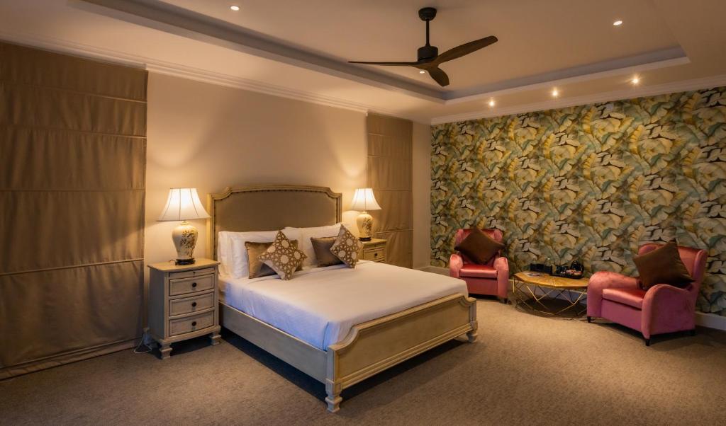 Postel nebo postele na pokoji v ubytování Villa Serenity