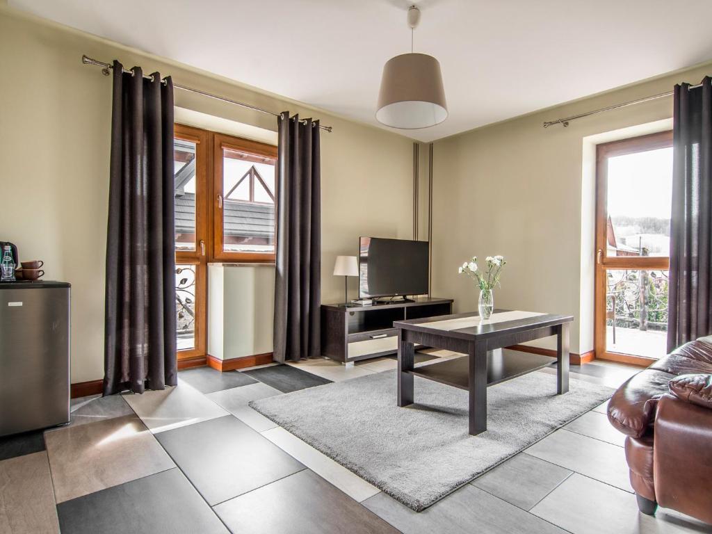 Posezení v ubytování Villa Magnat SPA, JACUZZI, SAUNA, TĘŻNIA SOLANKOWA