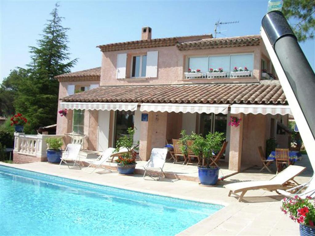 a house with a swimming pool in front of a house at Luxurious Holiday Home in Saint Rapha l with Jacuzzi in Saint-Raphaël