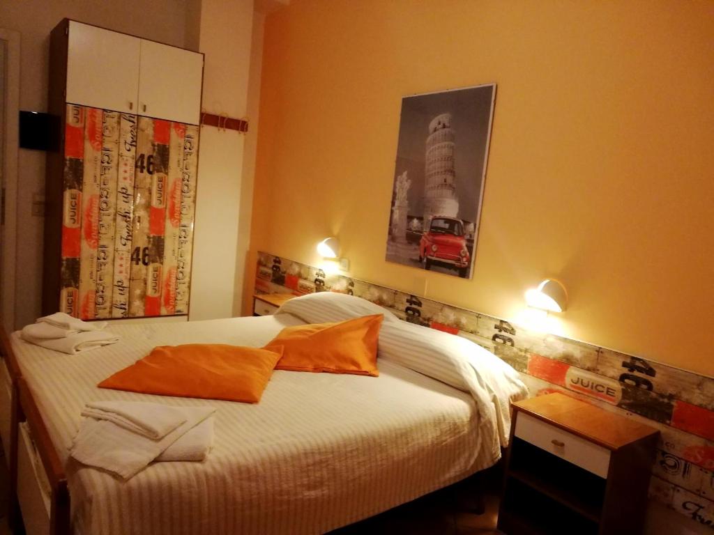 Postel nebo postele na pokoji v ubytování Hotel Galles Rimini