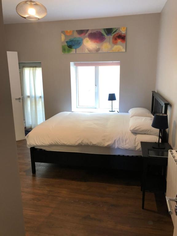 Voodi või voodid majutusasutuse Beach Haven Apartments toas