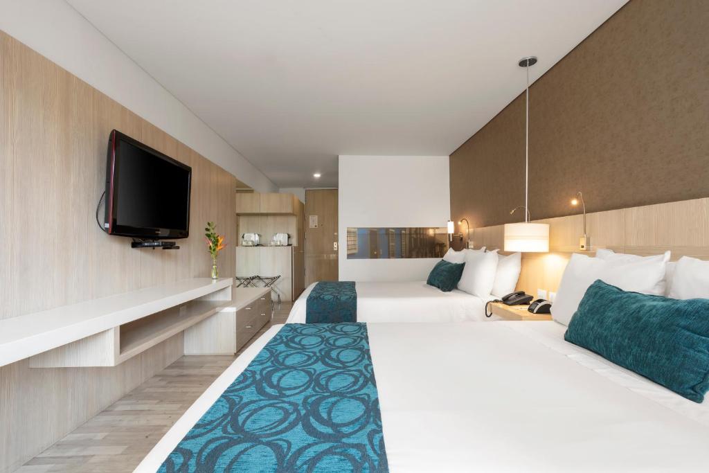 Postel nebo postele na pokoji v ubytování Hotel bh Bicentenario