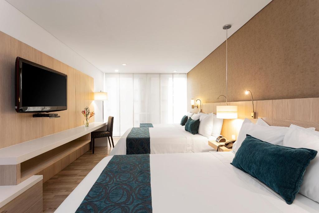 Postel nebo postele na pokoji v ubytování Hotel bh Bicentenario