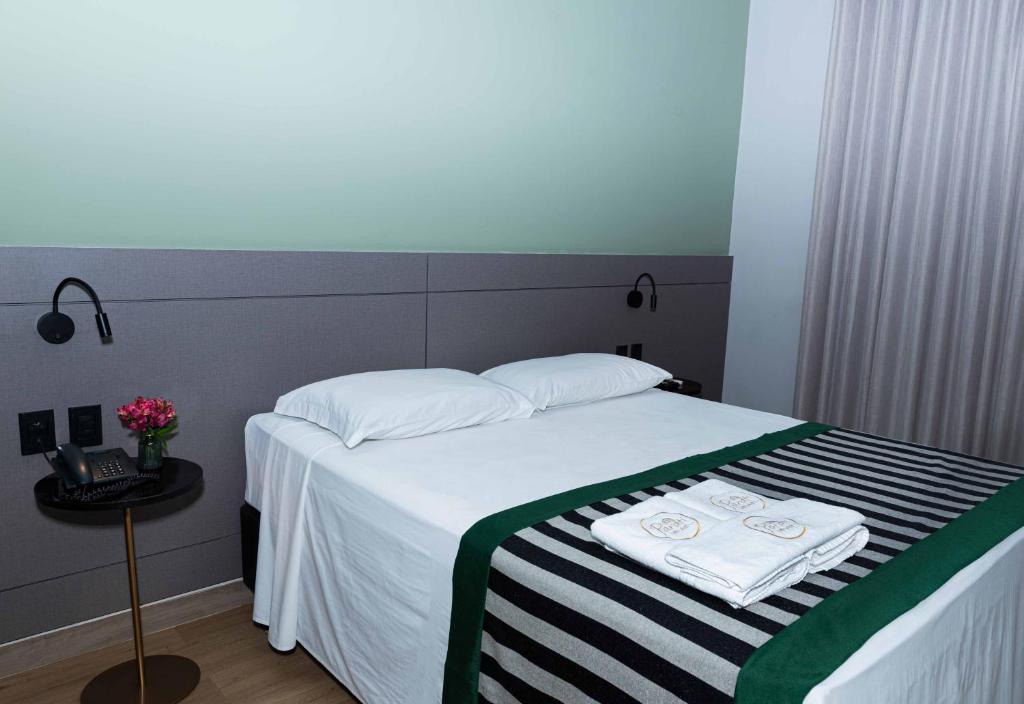Postel nebo postele na pokoji v ubytování Hotel Parati Minas