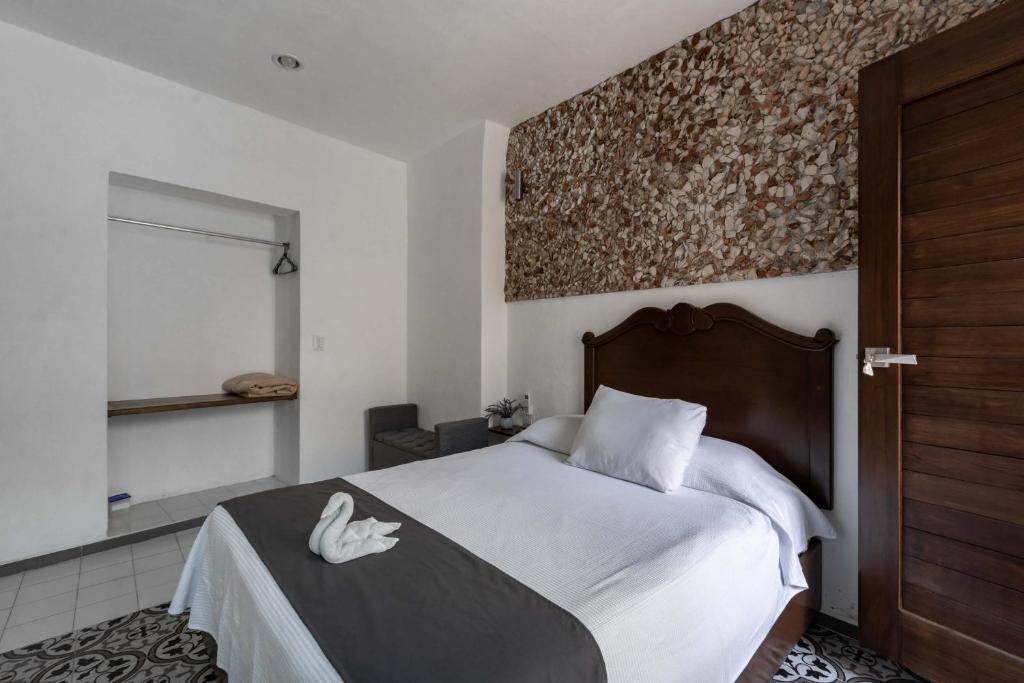 Postel nebo postele na pokoji v ubytování Hotel Colonial Zaci by GuruHotel