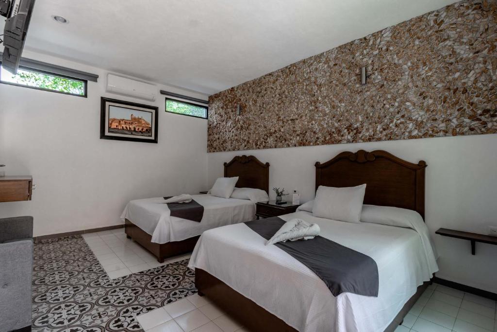 Postel nebo postele na pokoji v ubytování Hotel Colonial Zaci by GuruHotel