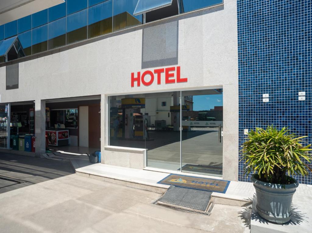 a hotel sign on the side of a building at Hotel Barra Do Riacho, Aracruz in Barra do Riacho