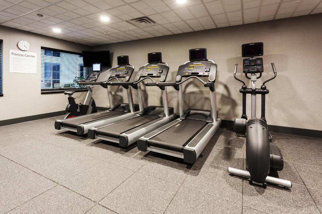 a row of cardio machines in a gym at Holiday Inn Express & Suites Rapid City by IHG in Rapid City