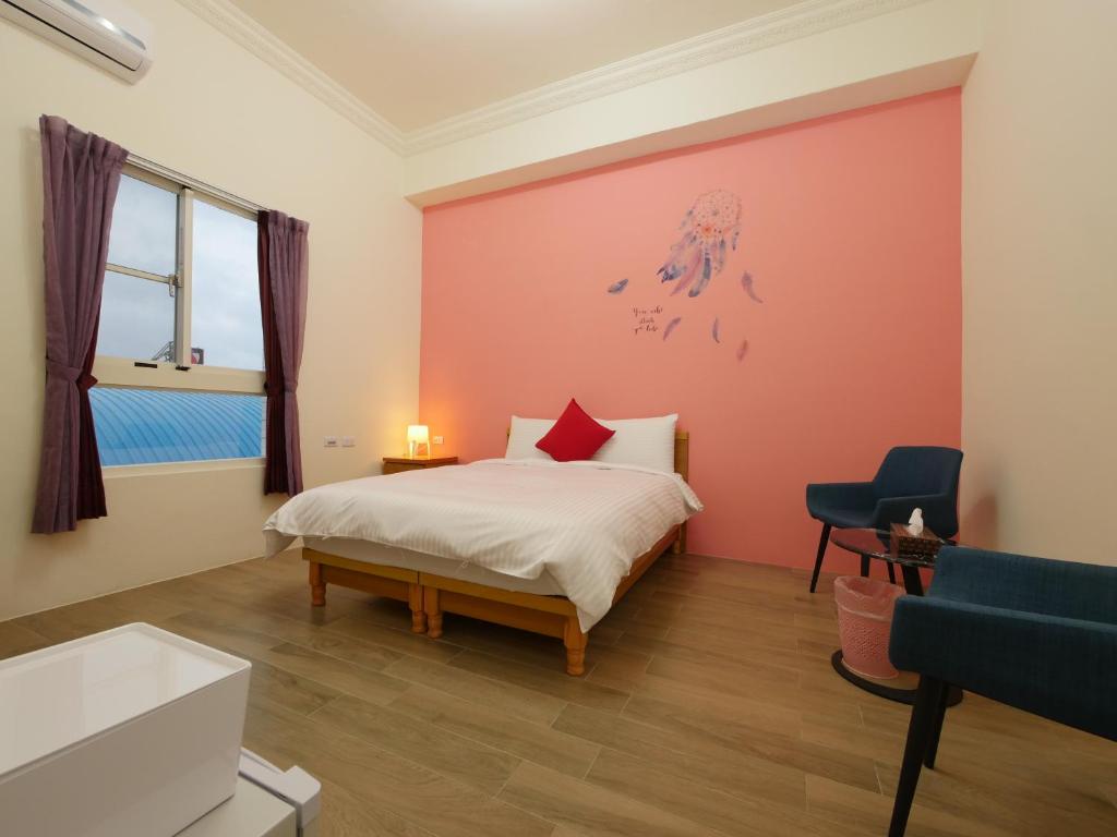Postel nebo postele na pokoji v ubytování Hengchun Inn