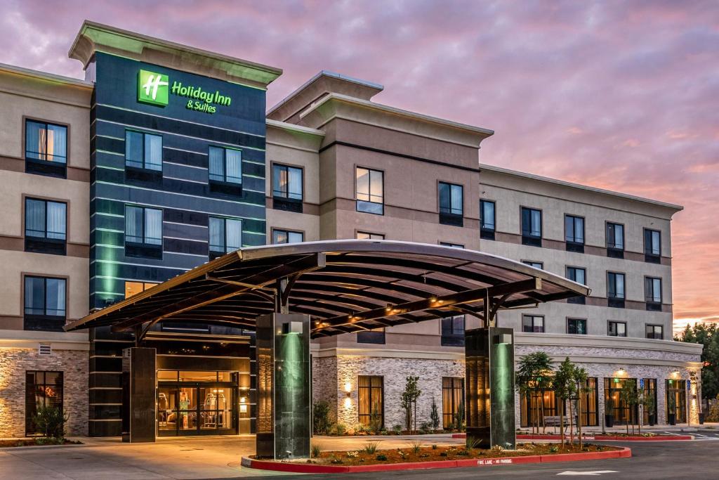 a hotel building with a canopy in front of it at Holiday Inn Hotel & Suites Silicon Valley – Milpitas, an IHG Hotel in Milpitas