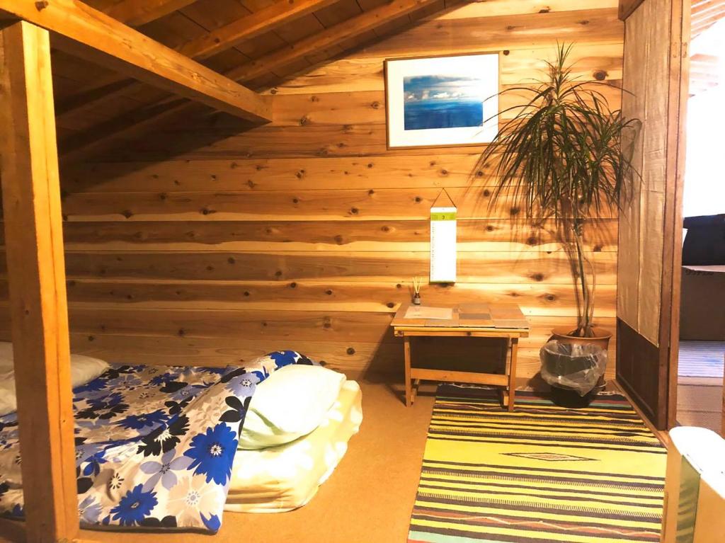 Voodi või voodid majutusasutuse 銀河荘-Galaxy Guesthouse 12歳以下不可 toas