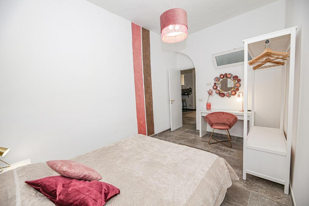 Łóżko lub łóżka w pokoju w obiekcie Casa Raffadali, in centro storico a Palermo