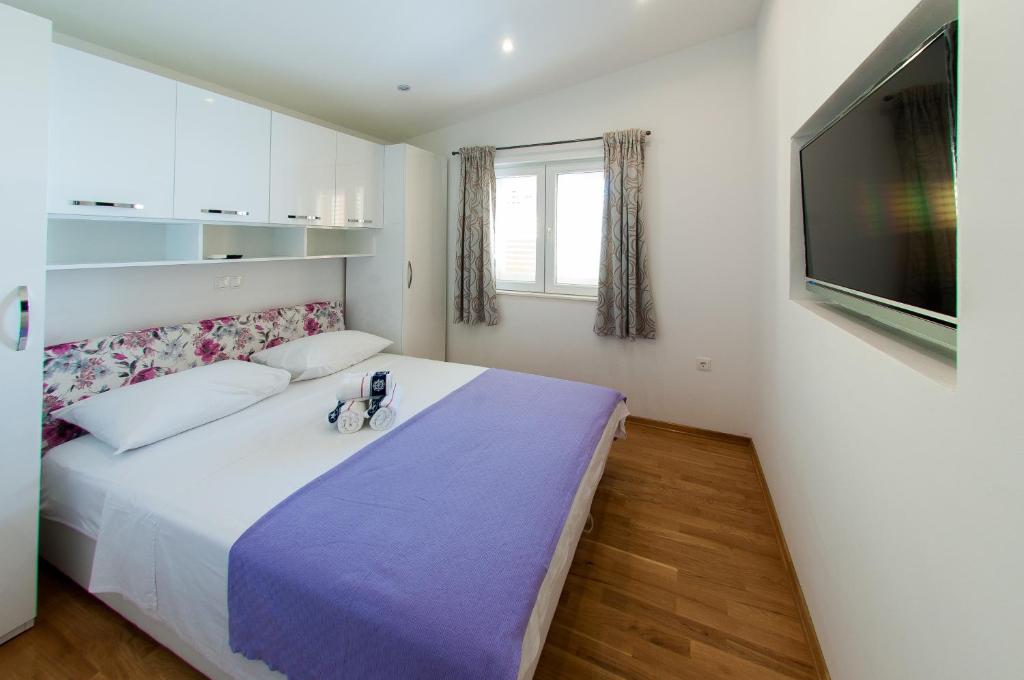 Postel nebo postele na pokoji v ubytování Apartments Anita