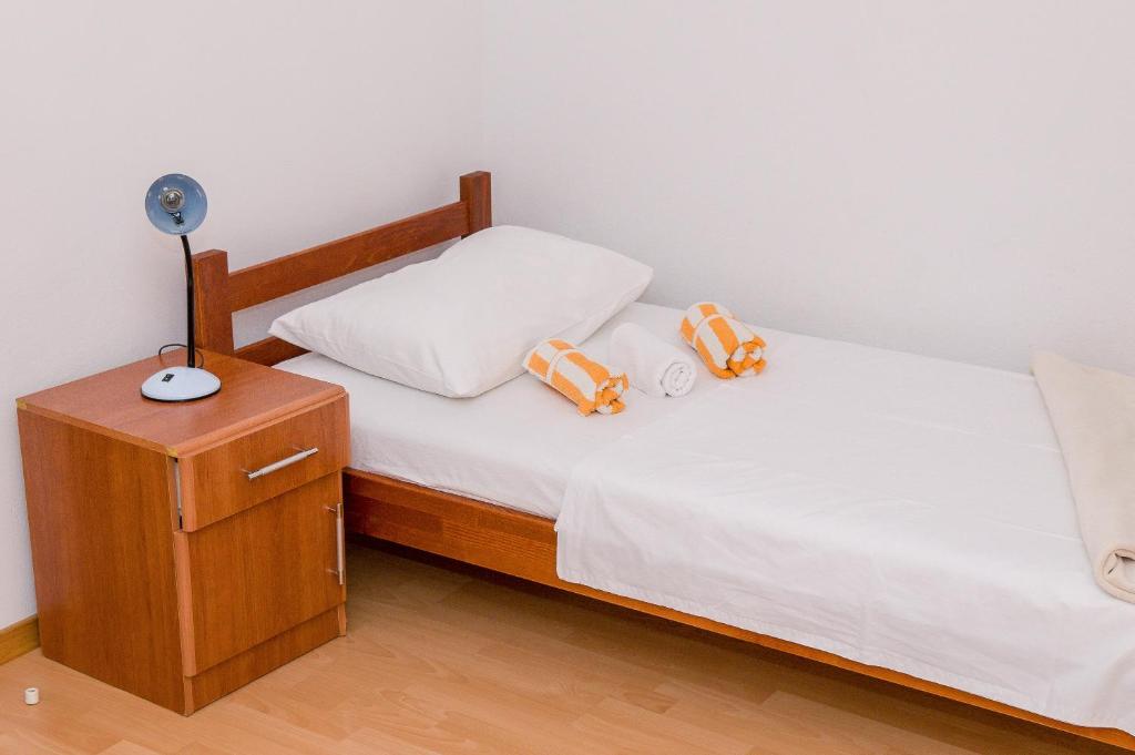 Postel nebo postele na pokoji v ubytování Apartments Anita