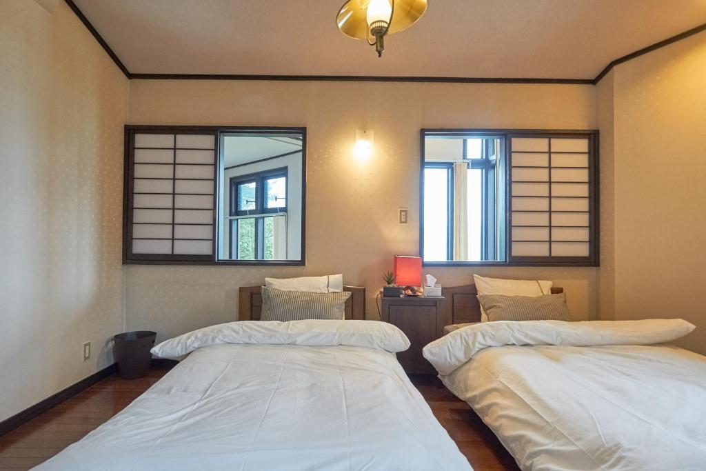 Postel nebo postele na pokoji v ubytování Chalet Itomic L - Lake view -