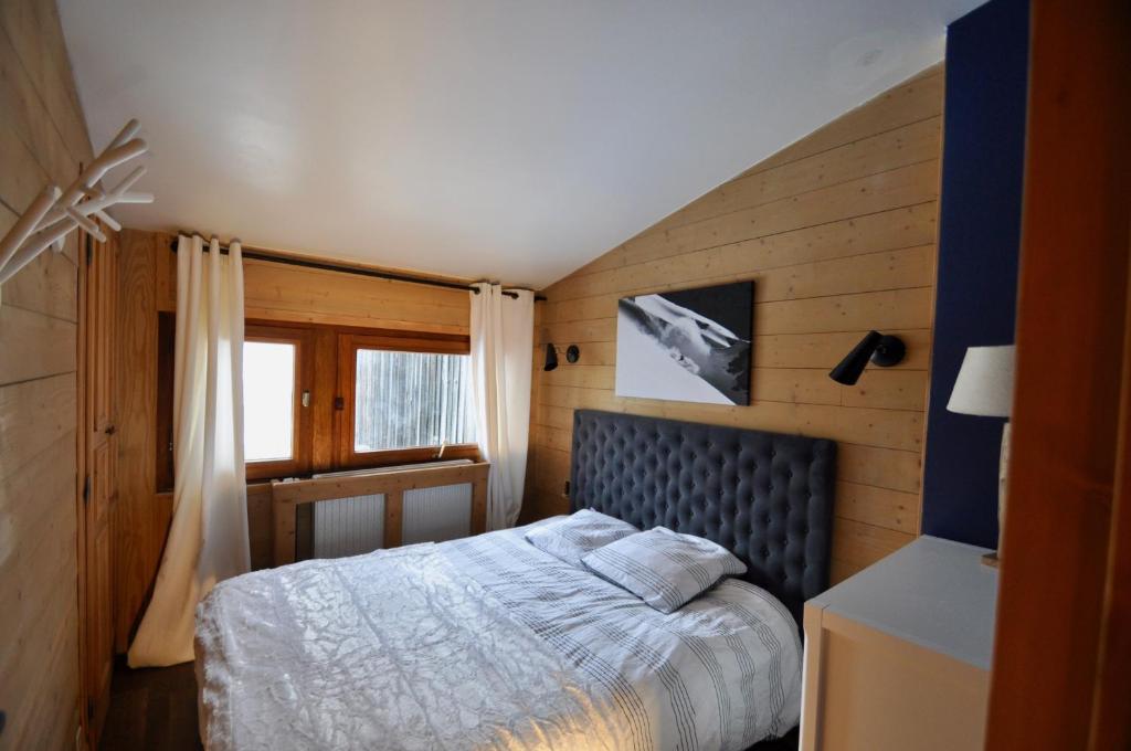 En eller flere senge i et værelse på Beau Chalet rénové vue lac Tignes