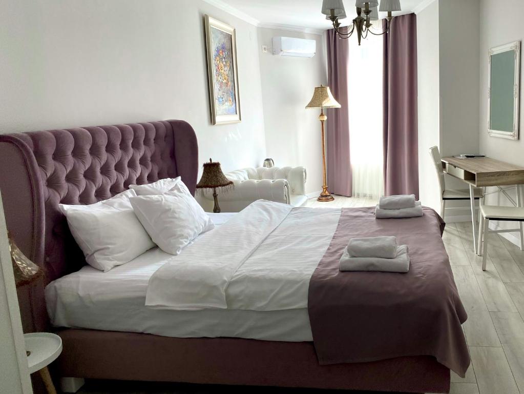 Letto o letti in una camera di Opera Center Hotel & Apartments