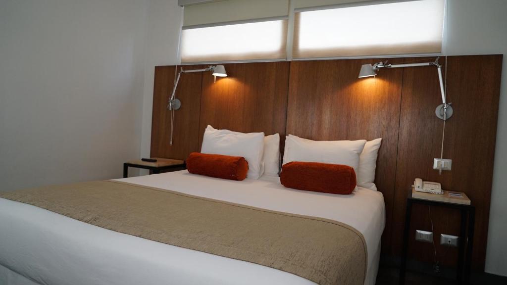 Postel nebo postele na pokoji v ubytování Natalino Hotel Patagonia