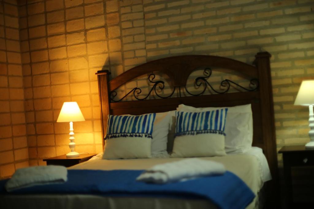 Postel nebo postele na pokoji v ubytování Sol de Luque Casa-hotel