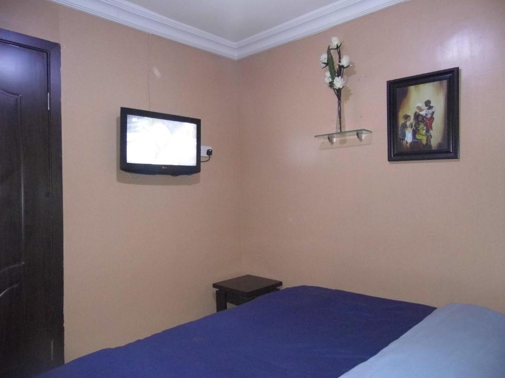 Postel nebo postele na pokoji v ubytování StayCation Suites And Apartment