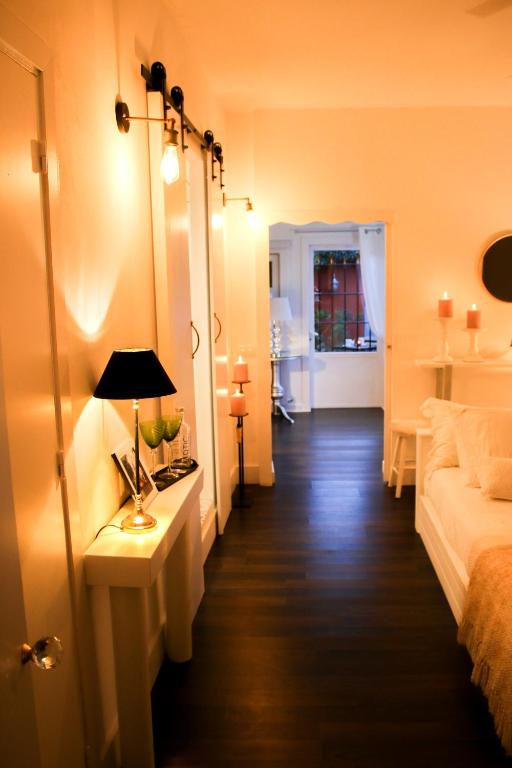 Posteľ alebo postele v izbe v ubytovaní Suite Garden House