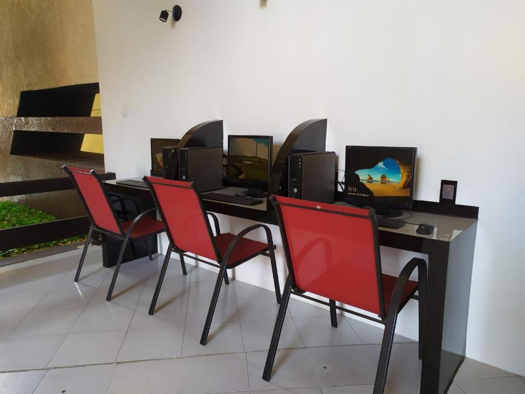 TV a/nebo společenská místnost v ubytování Hotel Cabildos