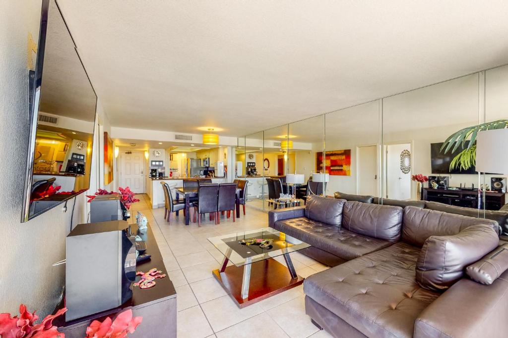 a living room with a couch and a table at Ocean Vista #102 in South Padre Island